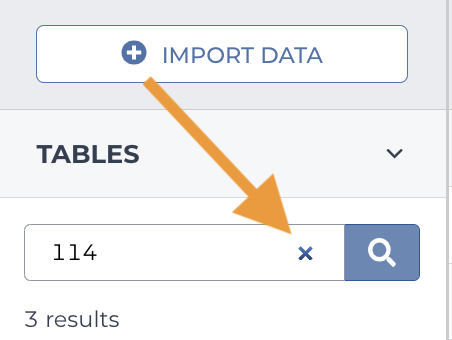 Screenshot of a cross-table search box where a search for '114' has been entered. An orange arrow highlights the 'x' in the search box, which is used to clear the search.